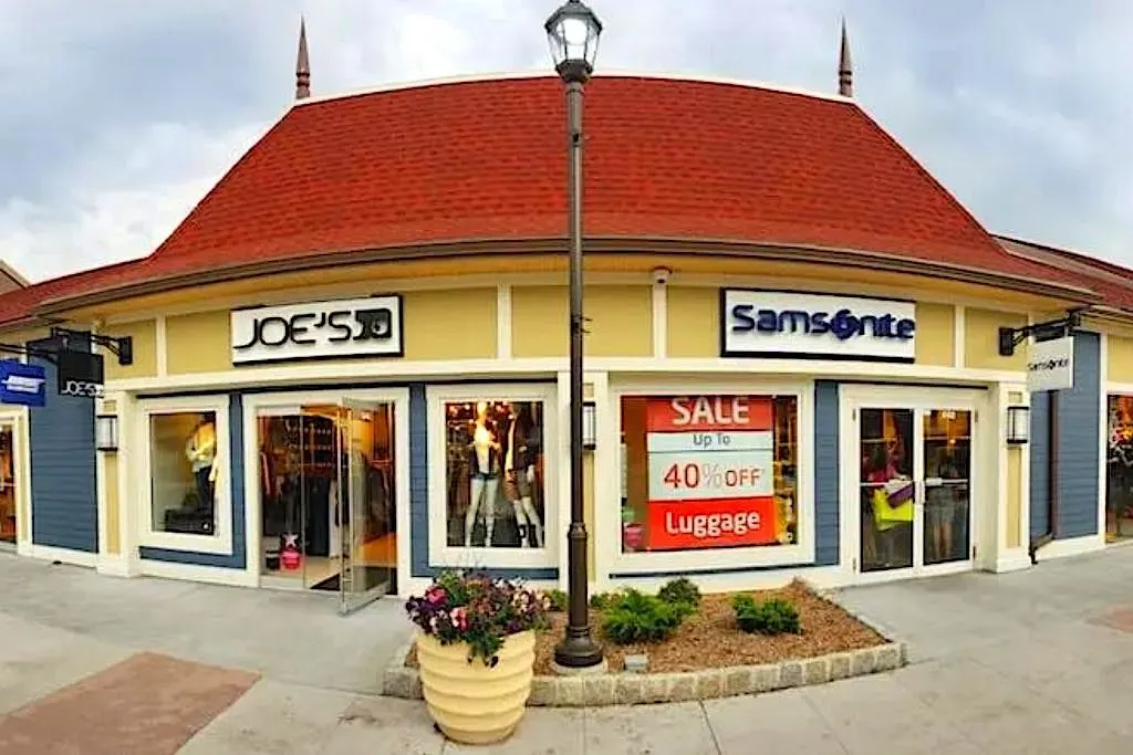 Storefronts at Woodbury Commons, one of the best places to shop in NYC on a budget. 