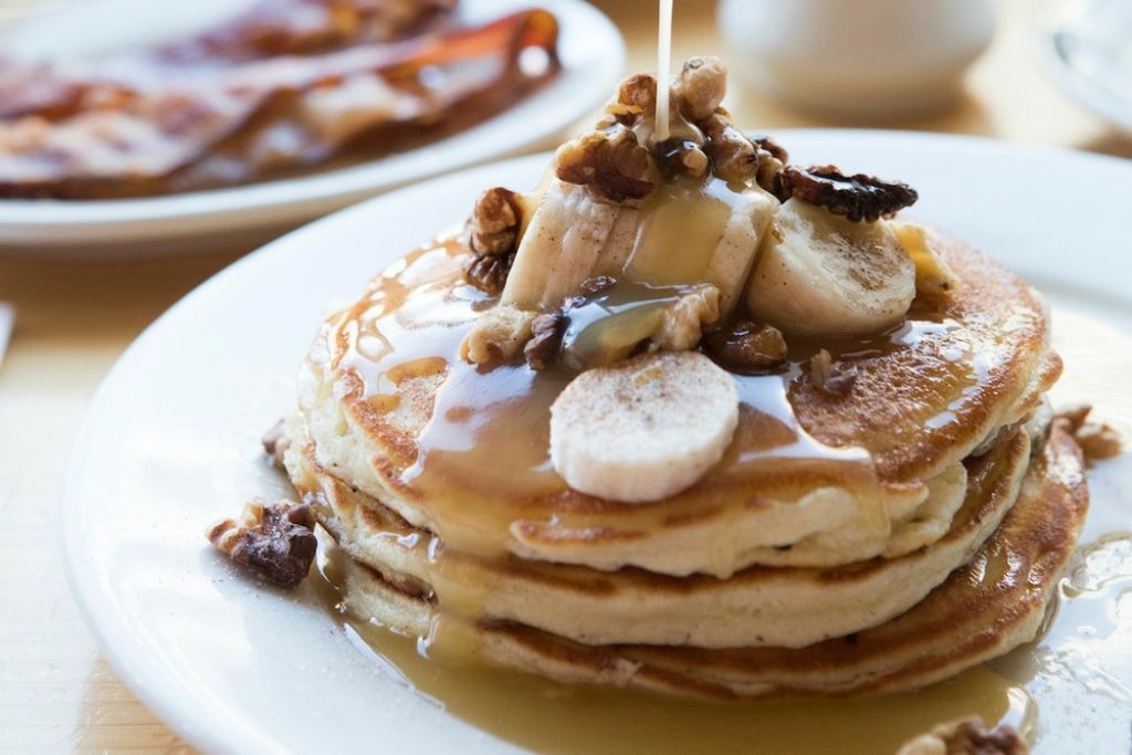 The best brunch in Brooklyn features bananas foster pancakes with lots of maple syrup. 