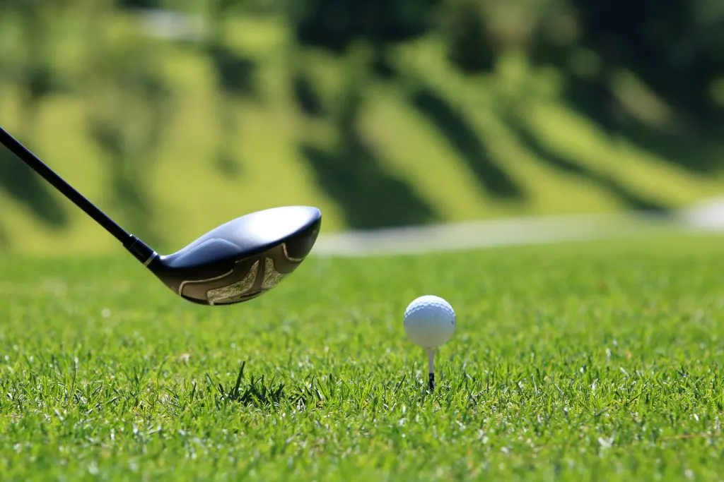 Putter by a ball at a golf course where you can enjoy the best things to do in Montauk, 