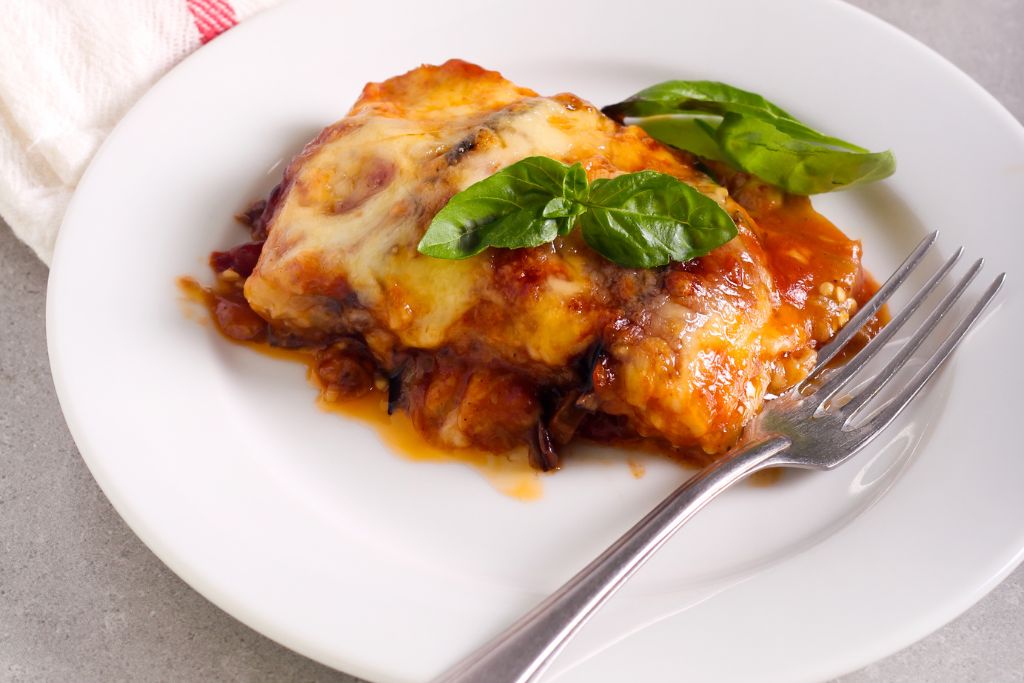 Authentic eggplant parmigiana is one of the foods you must try in NYC. 