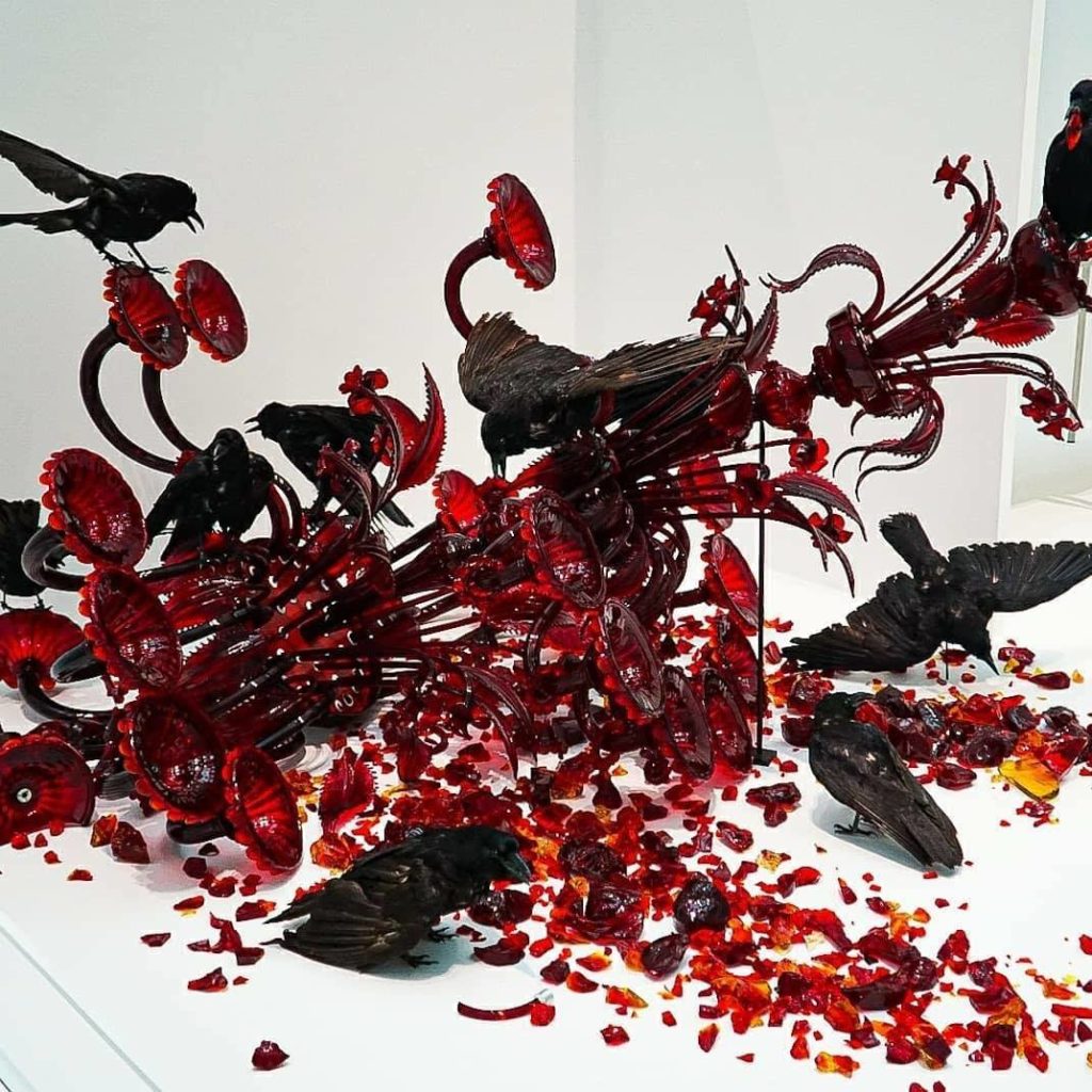 Incredible modern art exhibit with broken glass and crows at the Corning Museum of Glass. One of the best things to do in Corning nY. 