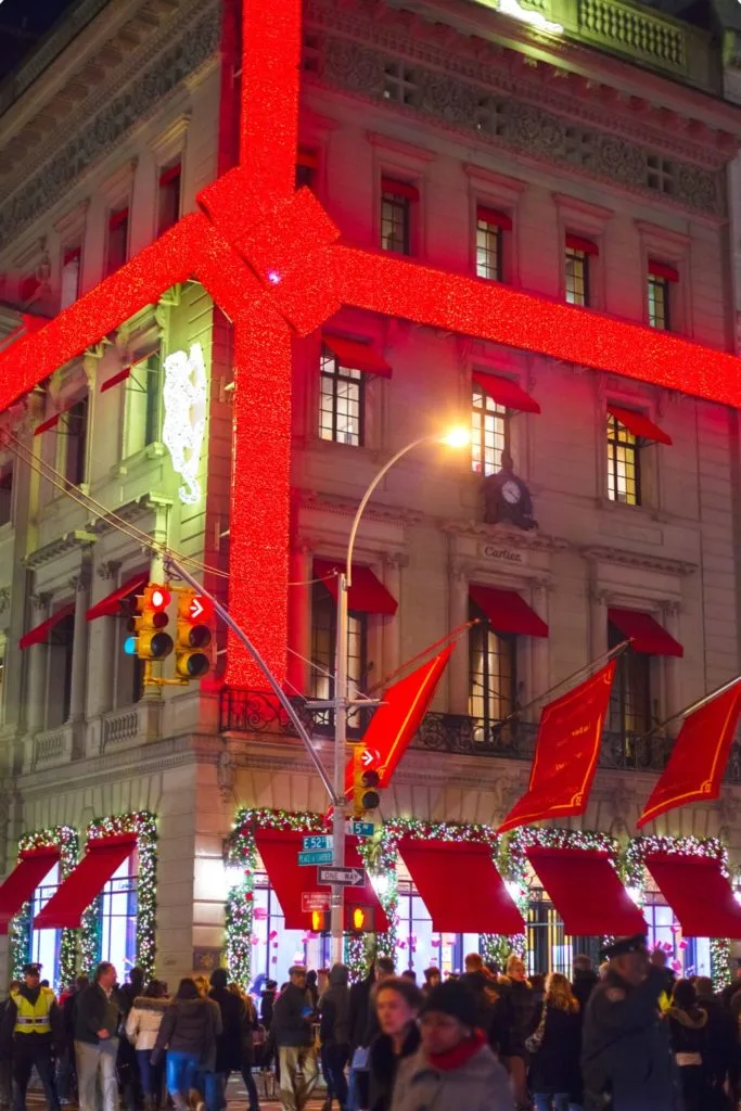 Giant red bow on the exterior of the Carteir store on Fifth Avenue.  