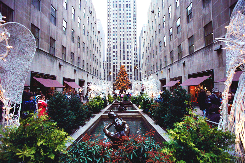 The Rockefeller Center Christmas Tree flanked by angels and home to the best New York Christmas lights of them all. 