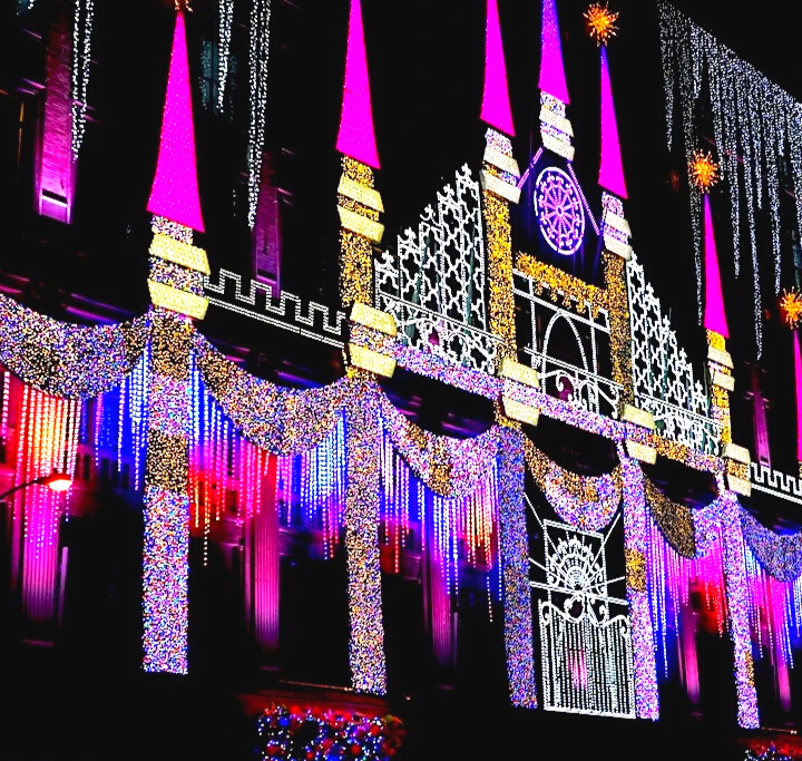 Vibrant lights on the Macy's building and one of the best things to do in NYC in Christmas.