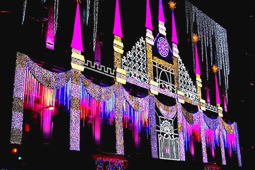 Vibrant lights on the exterior of Saks Fifth Avenue. It's a place where you can find the best Christmas lights in New York City. 