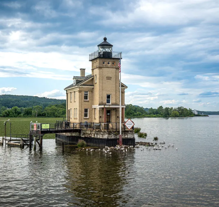 Kingston, NY – USA – Aug 2, 2022 Horizontal view of the historic Rondout Light, a lighthouse consisting of a square tower and attached to a rectangular, two-story dwelling. Built on the Hudson River.