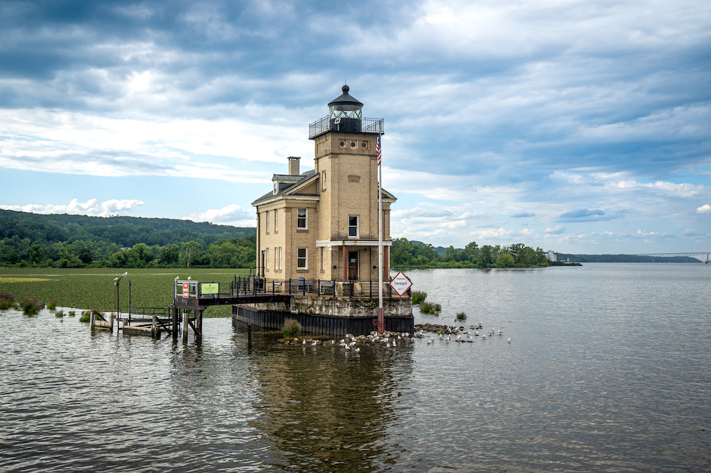 Kingston, NY – USA – Aug 2, 2022 Horizontal view of the historic Rondout Light, a lighthouse consisting of a square tower and attached to a rectangular, two-story dwelling. Built on the Hudson River.