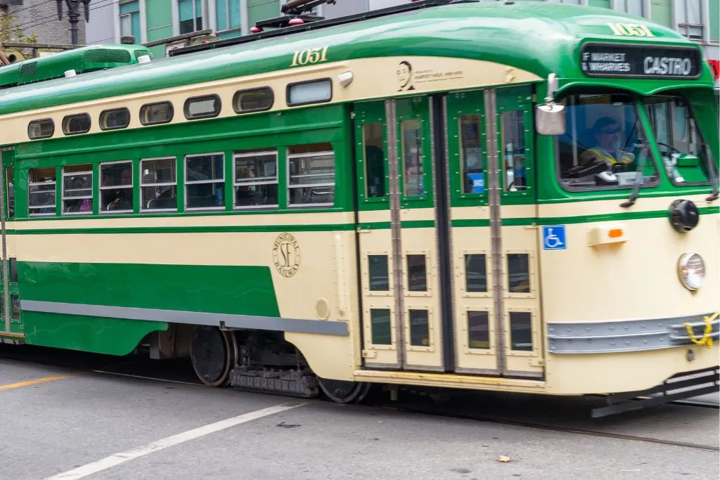 Historic green trolley on the stree. 