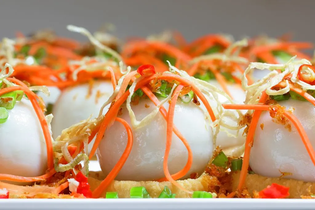 Vegan sticky rice dumplings topped with veggies that make up the best vegan breakfast in New York City. 