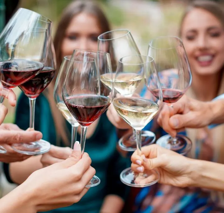 friends toasting wine during one of the best happy hours in Greenwich Village.