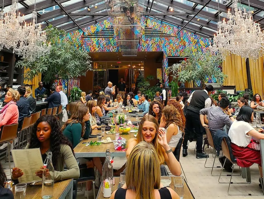 Chandeliers and vibrant heart Grafitti in Nomo Kitchen. 