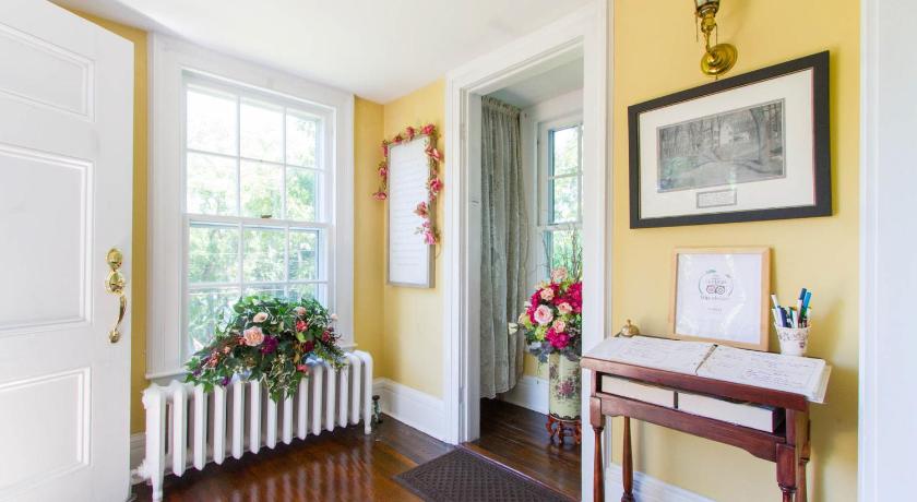 Bright, yellow interior of the Harbor Rose Bed and Breakfast. 