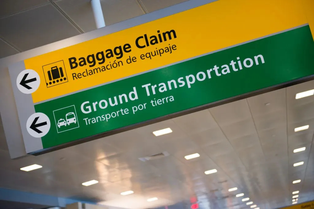 Ground transportation sign and baggage claim sign for JFK International airport. 