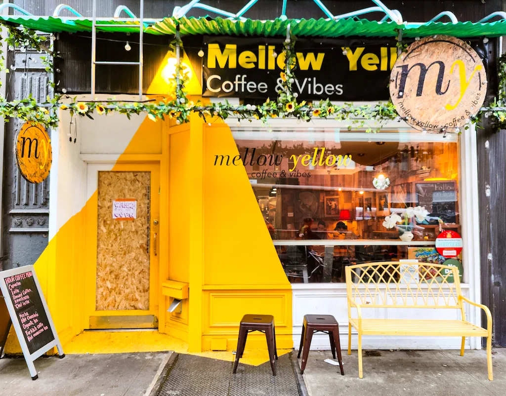 Vibrant yellow exterior of Mellow Yellow Cafe on the Upper East Side. 
