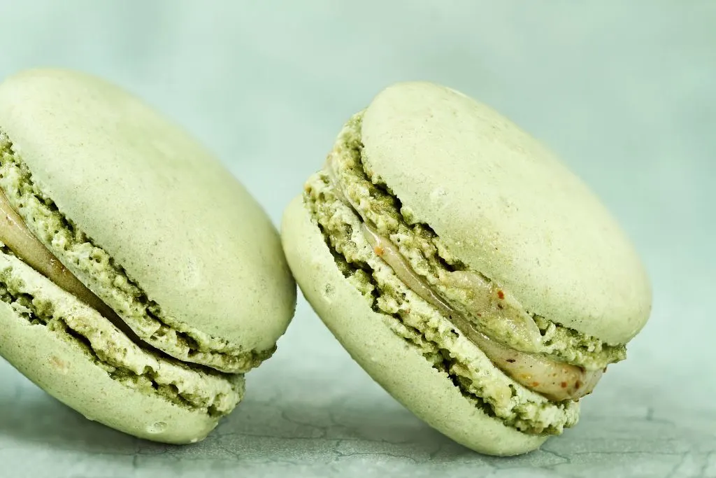 Two pistachio macarons from one of the best vegan bakeries in NYC. 