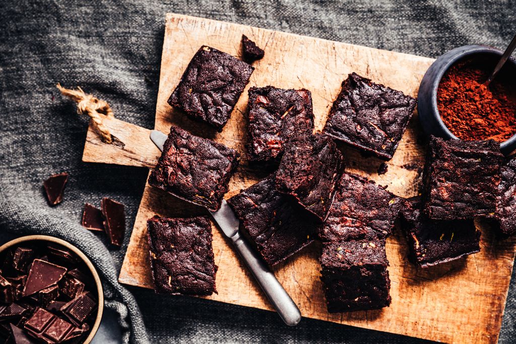 Vegan brownies on a cutting board from one of the best vegan bakeries in NYC. 