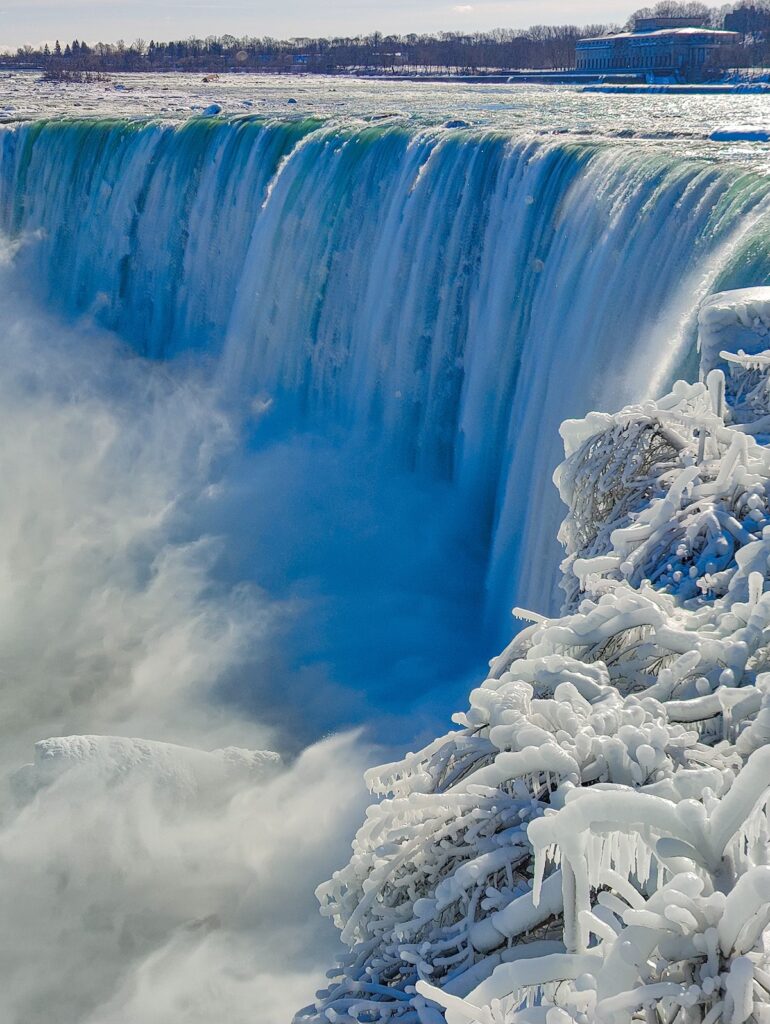 Up close view of Niagara Falls in the winter from the canadian side on a sunny day. 
