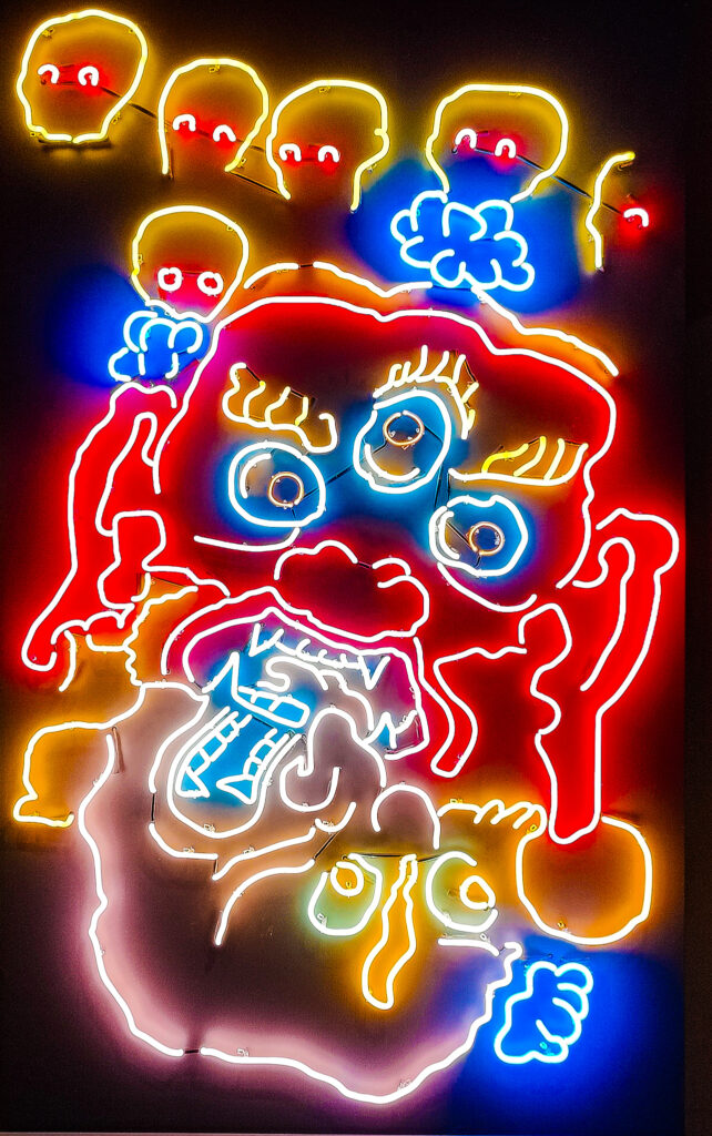 View of a neon sign at the Tibet House Musuem