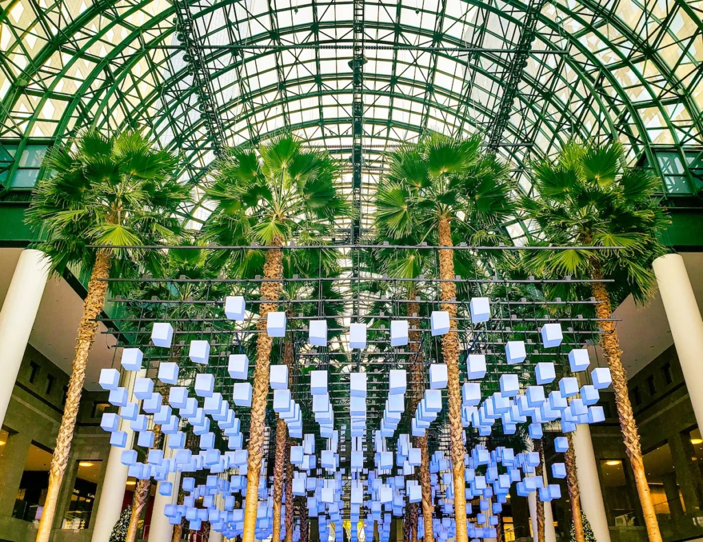 Blue luminaires that light up the palm trees at Brookfield Place. The glass ceiling also lets in a ton of light. 