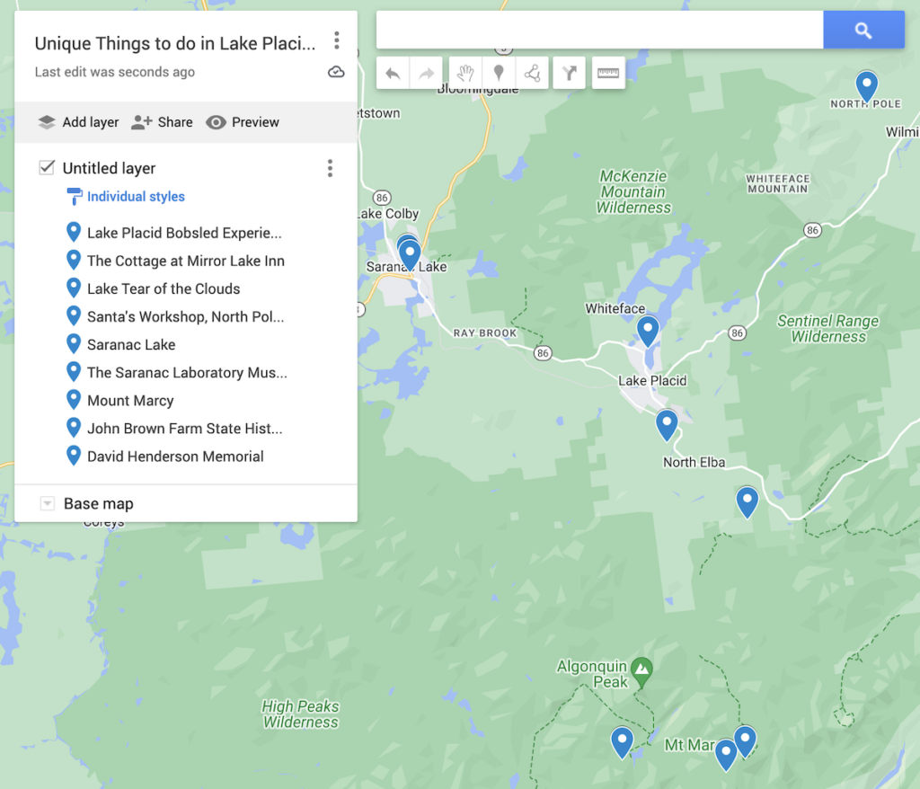 Map of the most unusual things to do in Lake Placid NY with blue dots to represent the 9 different places on the map. 